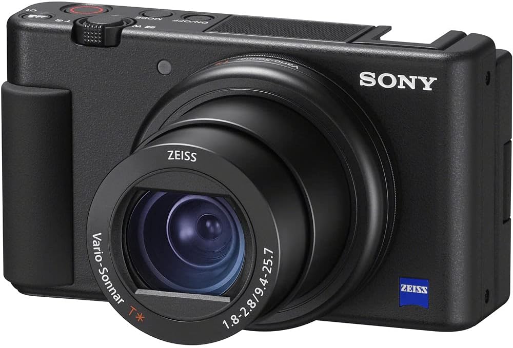 Sony ZV-1 Digital Vlogging Camera Black (DCZV1/B) – 20.1 MP 1' Sensor, 24–70 mm ZEISS Lens, 4K HDR Video, Flip Screen w/ 64GB Card, Photo Software, 2 x NP-BX1 Battery, Card Reader and More